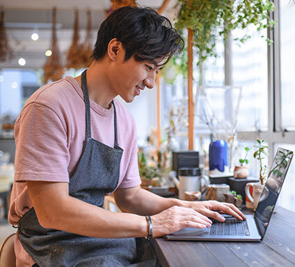 Young entrepreneur working on his laptop