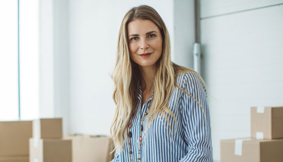 business owner standing in her office