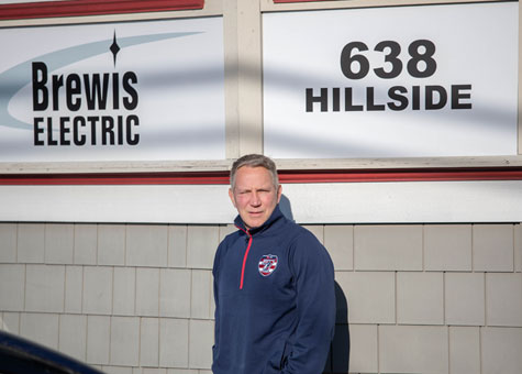Marc Wyatt - CEO of Brewis Electric in front of his headquarters