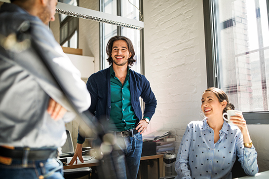 coworkers smiling and laughing together