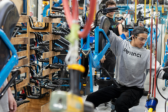 Devinci Bikes employees working in a factory