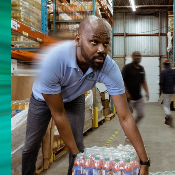 Isaaq Bosquet of Demasara working in his warehouse