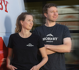 Cayleigh Rees and Irah Vet in front of their Hornby Organic truck