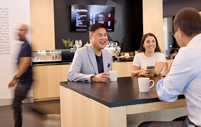 Employees meeting over coffee