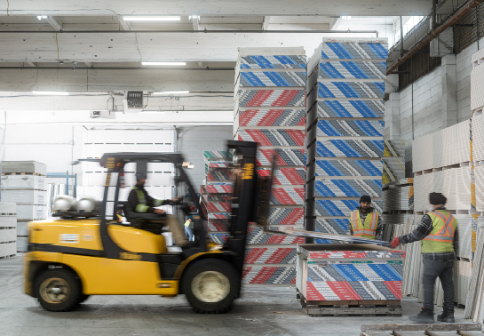 employees working in a building materials warehouse