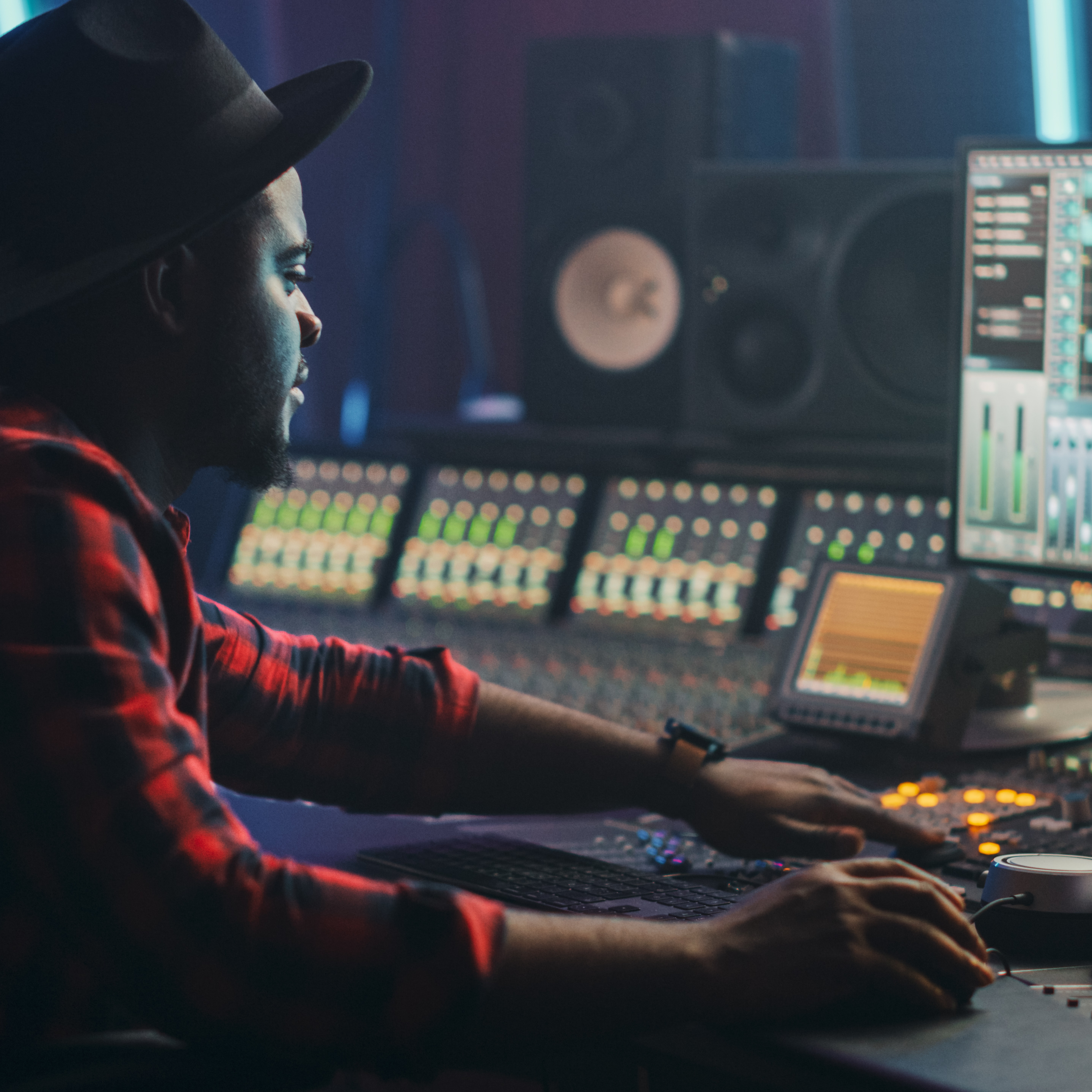 sound engineer in front of his consoles