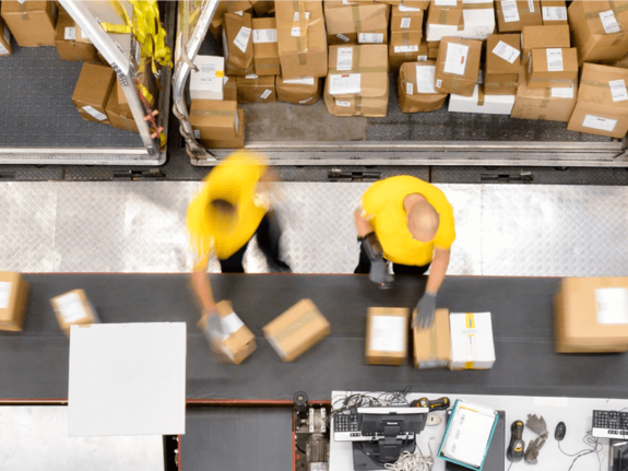 workers preparing boxes to ship