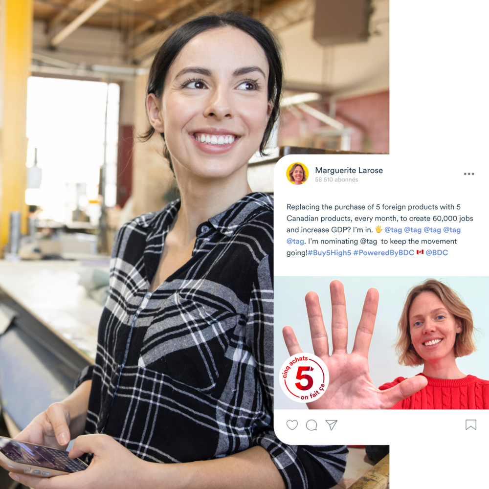 Woman smiling and holding up her hand