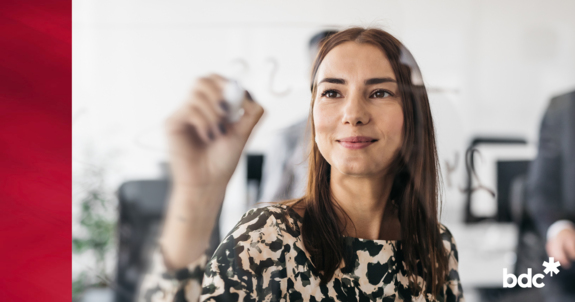 Woman writing on a glass